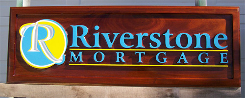 colorful carved wood interior sign or display with natural wood grain
